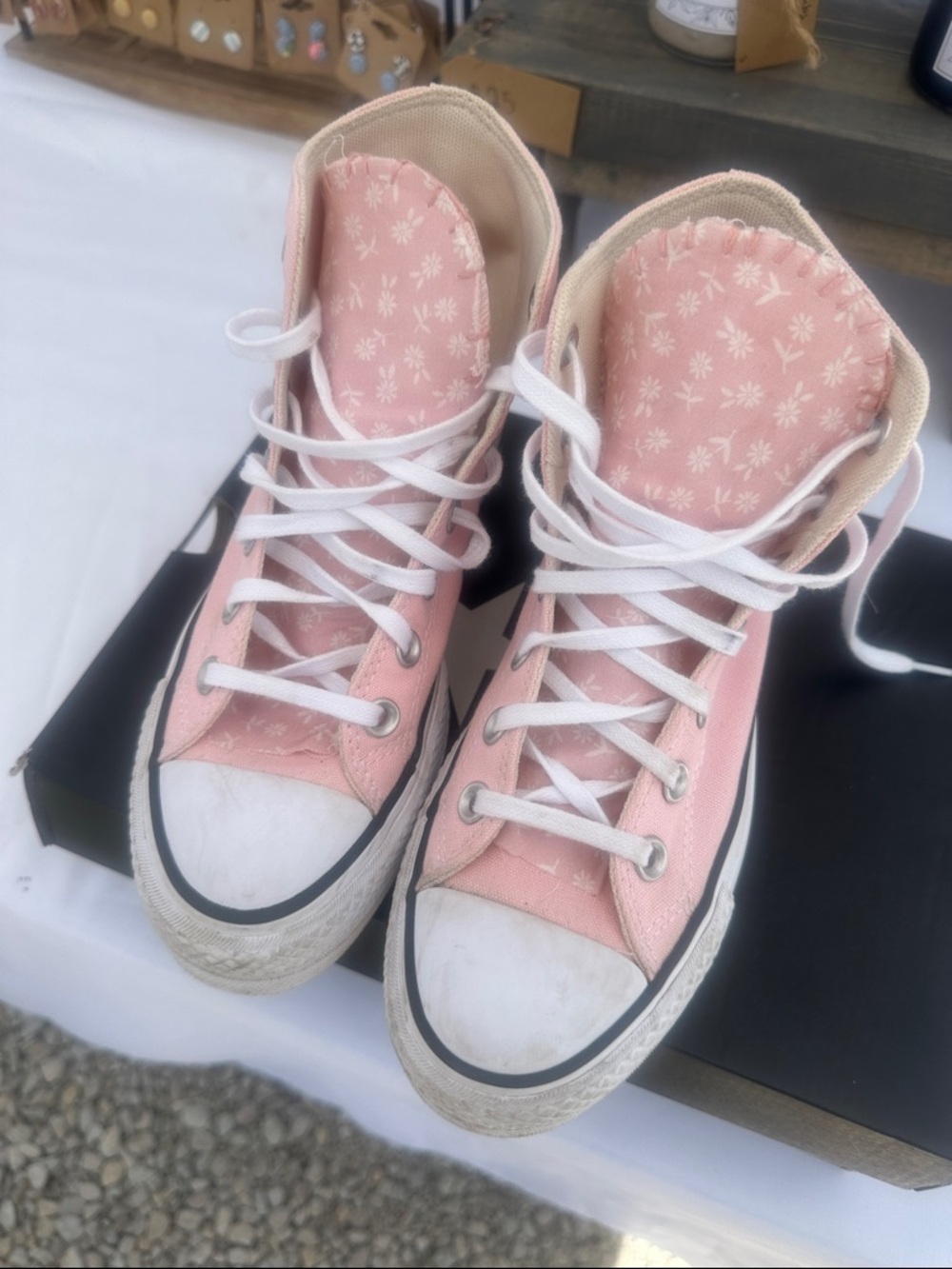 Converse Women's Light Pink High-Top Sneakers with floral white flowers.